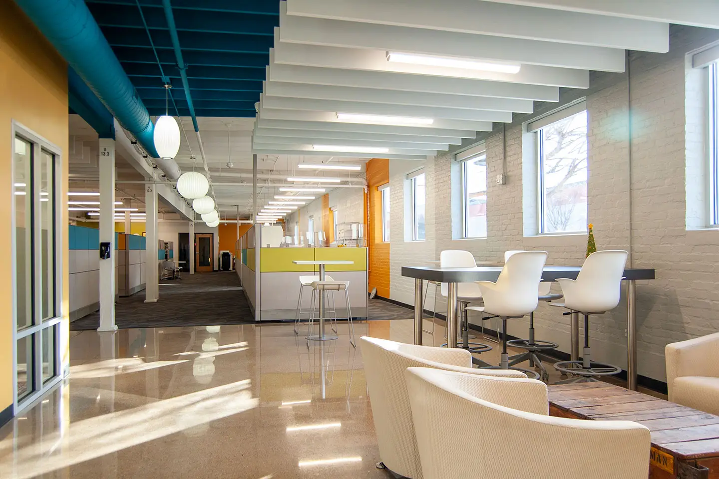 Executive desk setup inside the Holland, Michigan showroom, showing a workstation with seating and surrounding office furniture.