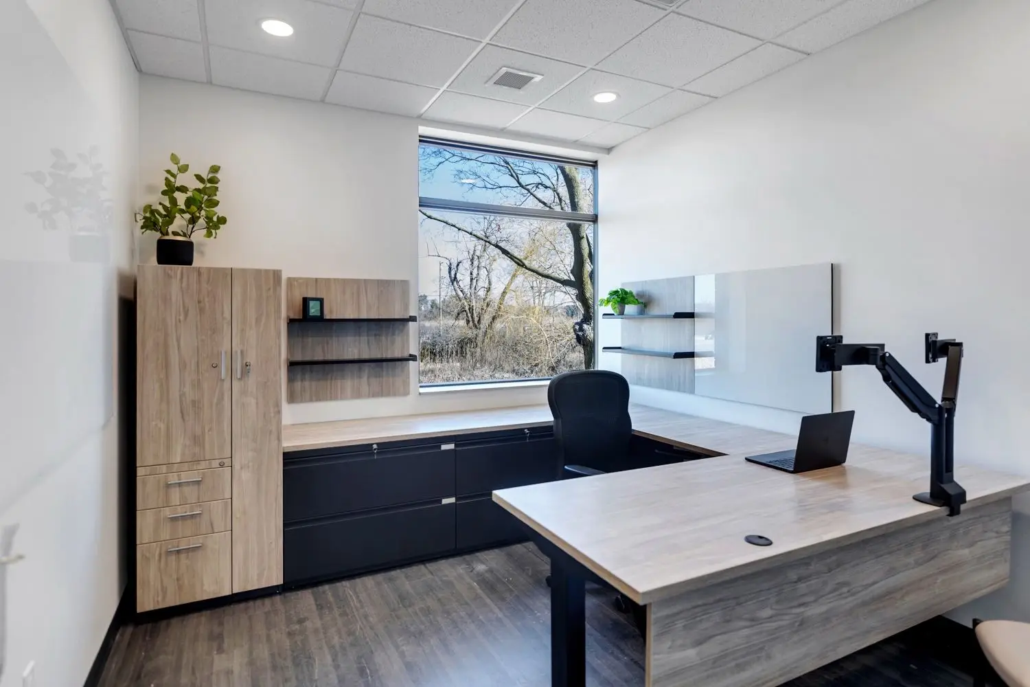 Wall-mounted display of material and finish samples inside the Holland, Michigan showroom.