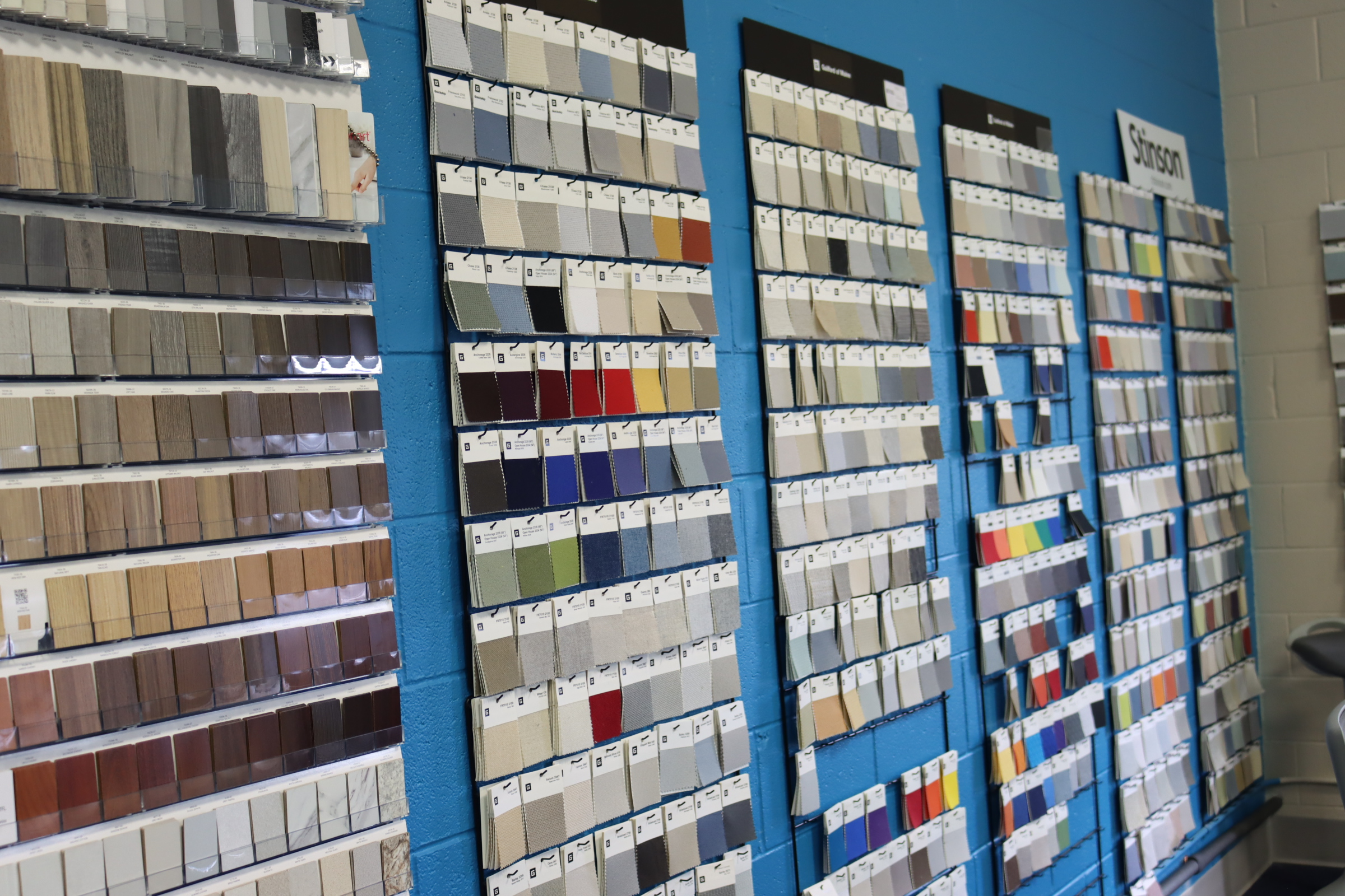 Fabric and material swatch display in the Kalamazoo showroom showing office furniture finish and upholstery options
