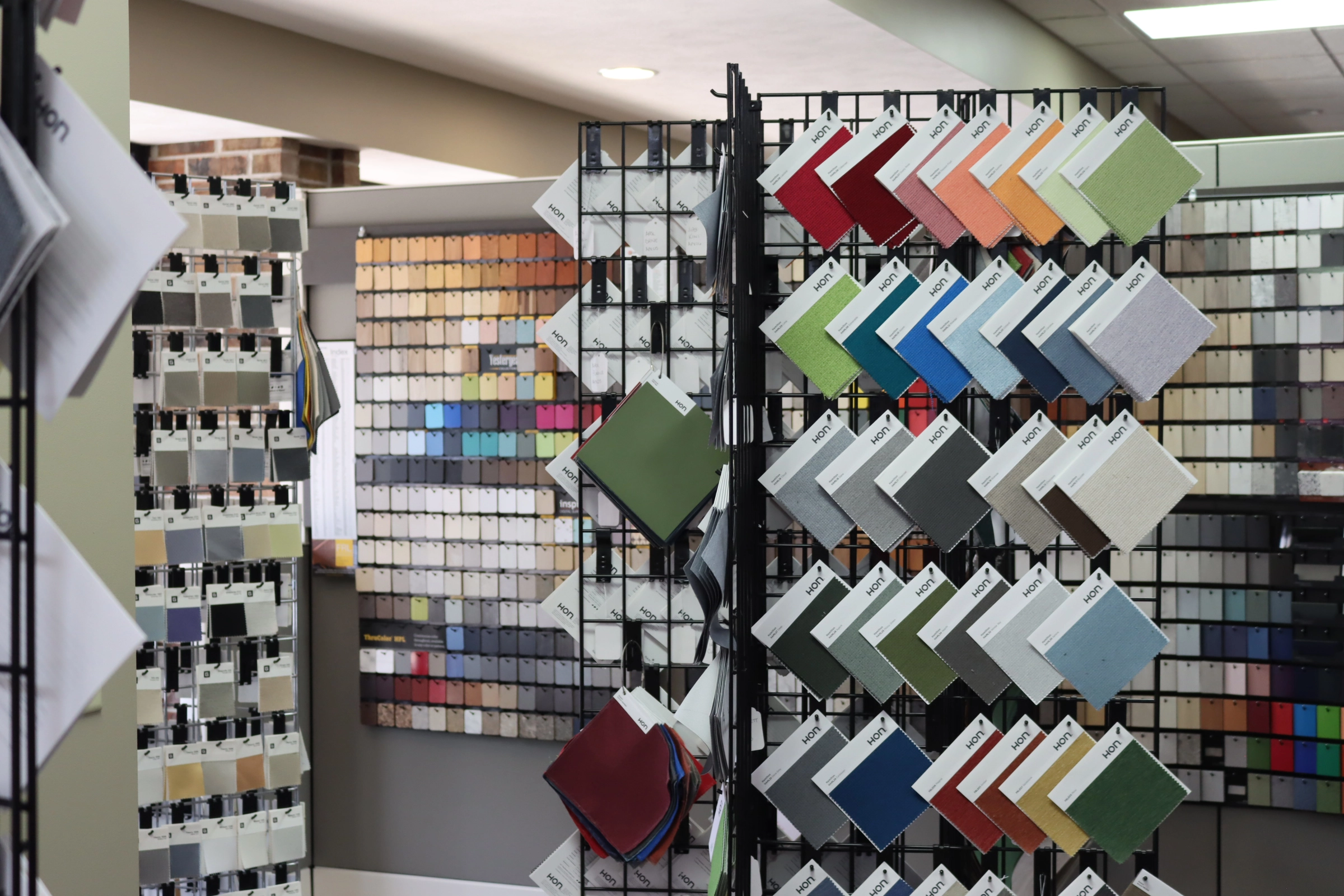 Fabric and material swatch display in the Kalamazoo showroom showing office furniture finish and upholstery options