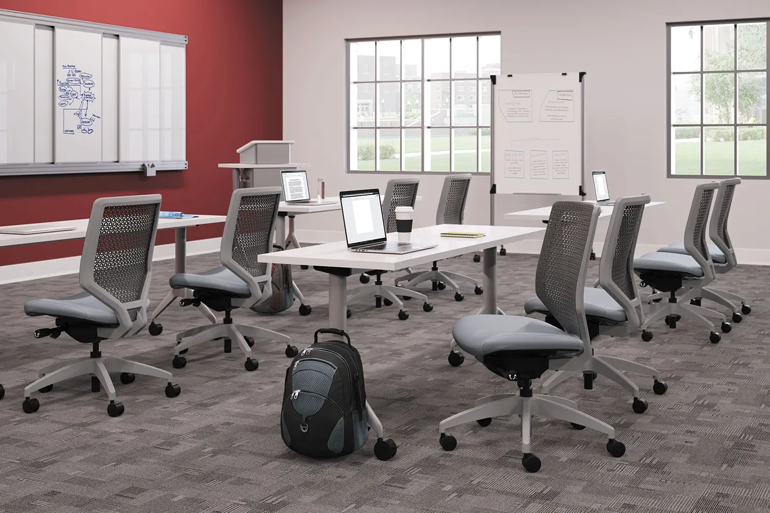 HON Motivate tables and task chairs arranged in a modern training room.