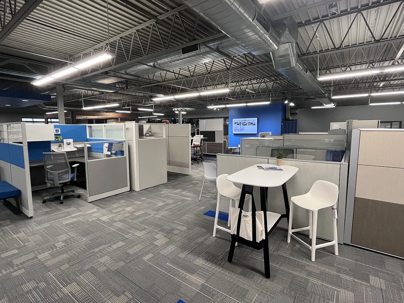 Fabric and upholstery sample racks inside the Holland, Michigan showroom, organized for browsing and comparison
