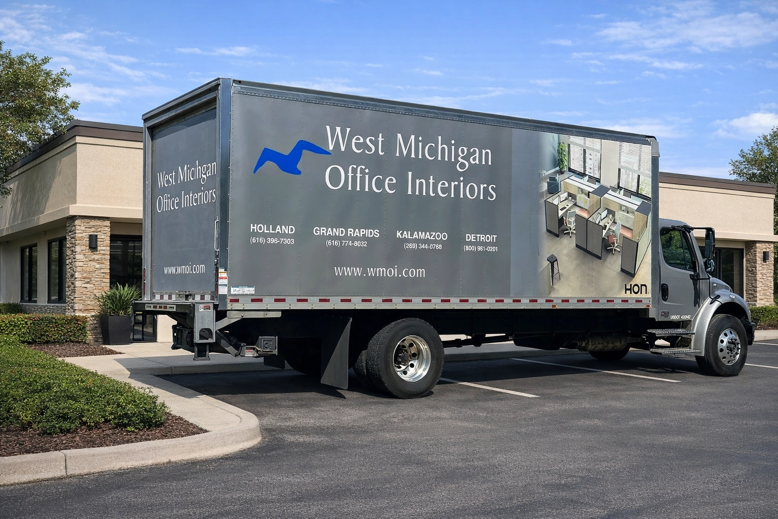West Michigan Office Interiors delivery truck outside office building