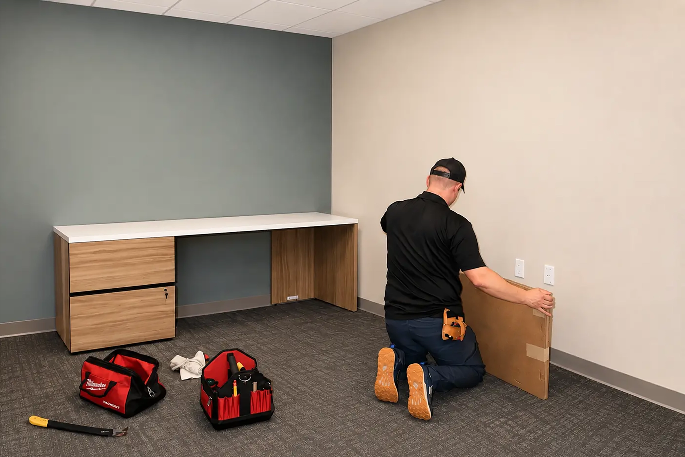 Worker installing furniture.